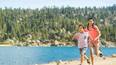 Kids running on a beach
