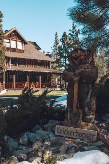 Big Bear's Knickerbocker Mansion with a welcome bear in the foreground.